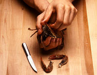 Photo depicting step two of cracking into a crab.