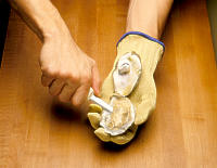Photo depicting step five of bisecting an oyster.